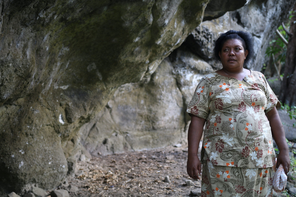 Vilimaina Ratu -Tukuraki village member standing in front of the cave